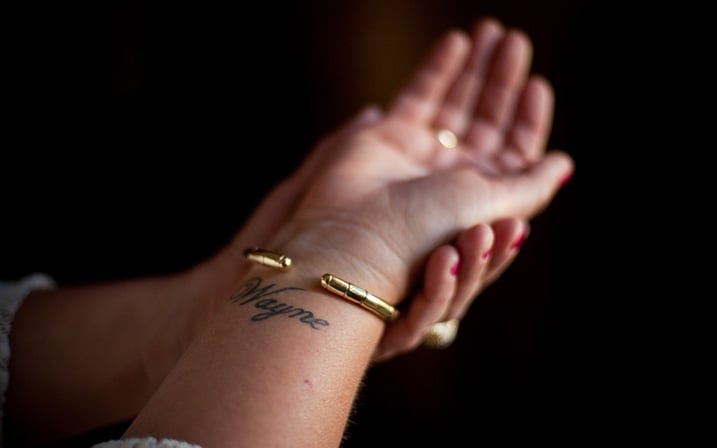 Lynne Davis displays a tattoo she had made on her wrist in honor of her son, Wayne Davis. Photo by Brandon Thibodeaux.