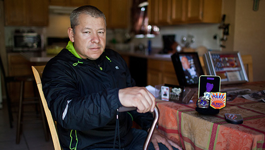 Former El Paso police officer Ricky Lopez with the Purple Heart medal he received from the city. Photo by Ivan Pierre Aguirre.